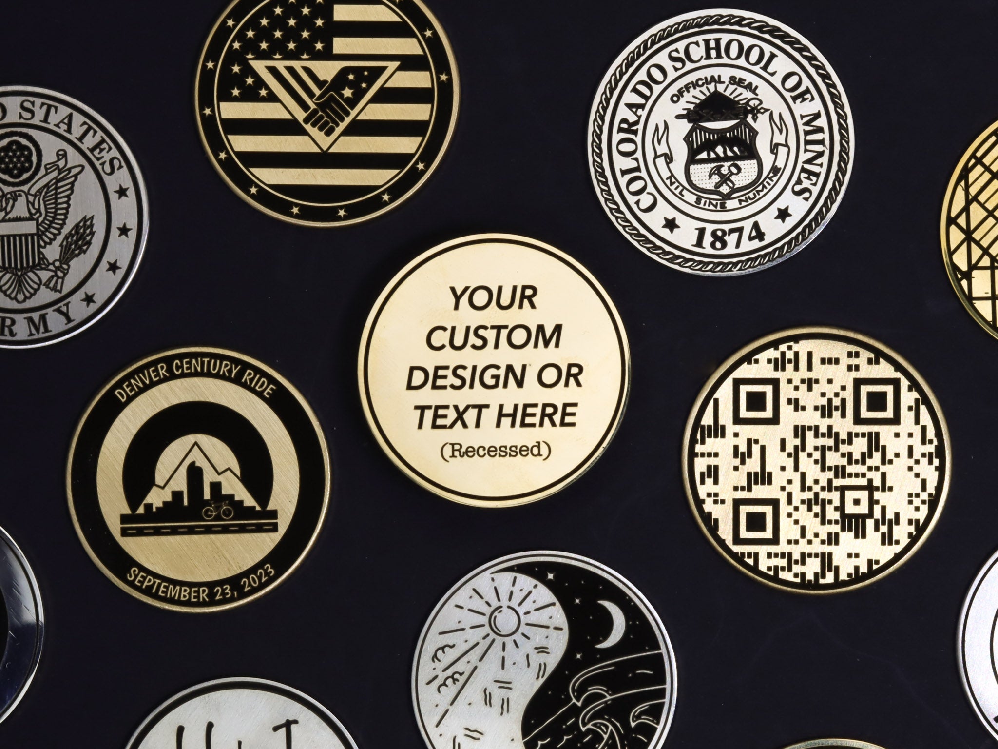 Several custom laser engraved challenge coins 